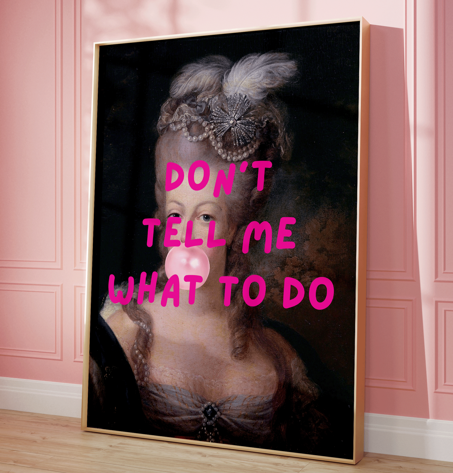 Funny feminist altered wall art featuring a vintage-style portrait of a royal woman with pink bubblegum and bold text that reads “Don’t Tell Me What to Do.” Rococo-inspired Marie Antoinette. black framed canvas wall art print.