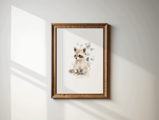 Watercolor raccoon nursery wall art print with eucalyptus foliage in a brown wood frame