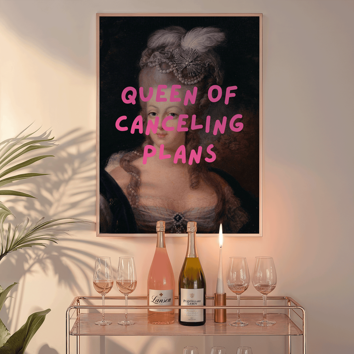 Queen of Canceling Plans print above a bar cart with champagne and glasses
