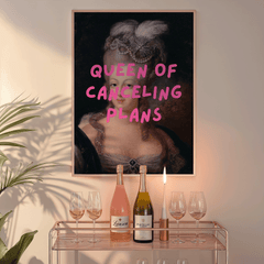 Queen of Canceling Plans print above a bar cart with champagne and glasses