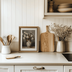 Rustic vintage floral print framed on a minimal kitchen countertop with flowers