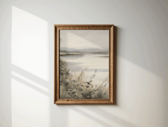 Soft landscape wall art with a lake, flowers and mountains, in rustic wood frame on minimal white wall