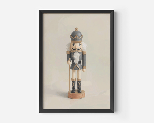 Close-up product mockup of a vintage nutcracker Christmas canvas in a black frame against a soft beige background