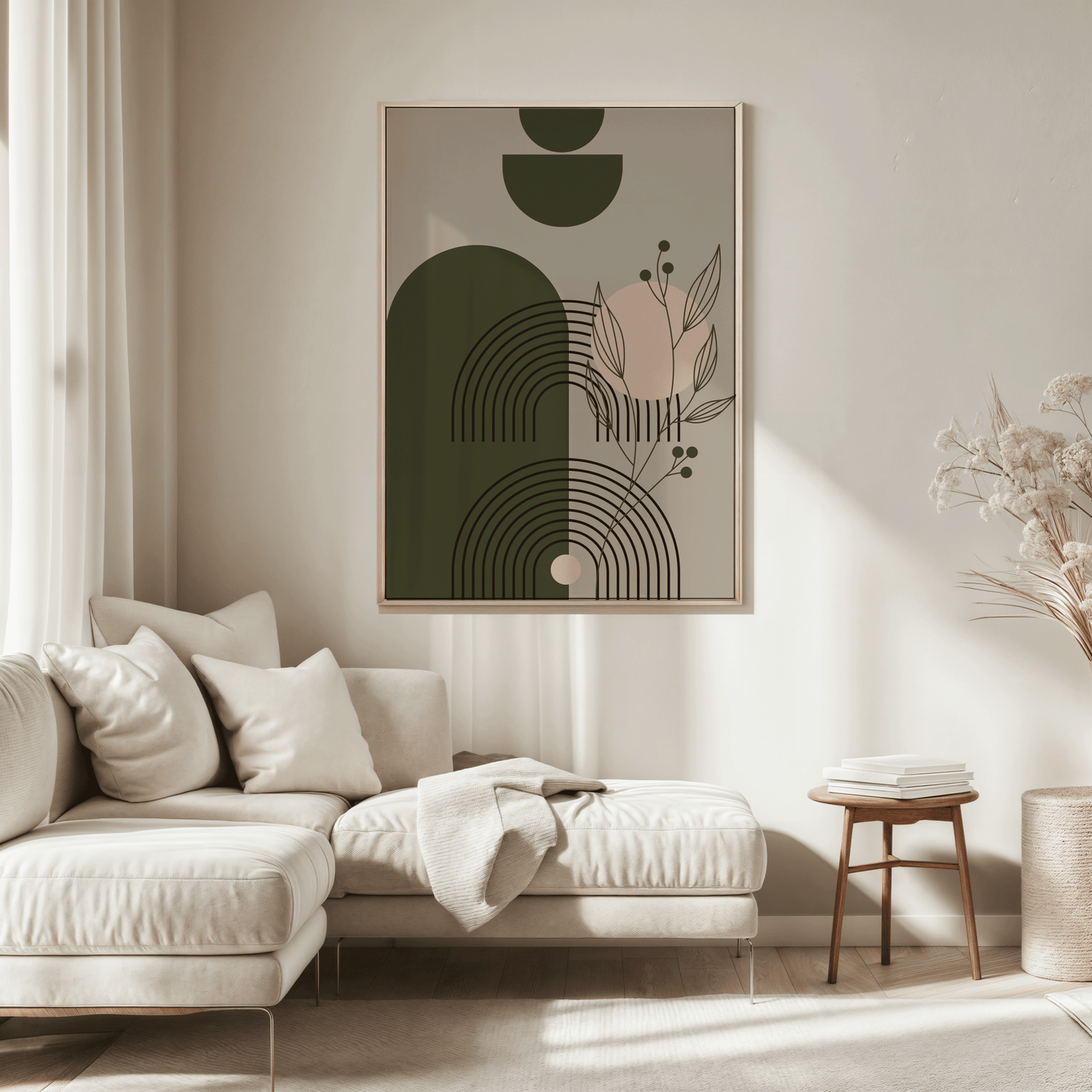 Sage green botanical geometric print in a wood frame above a beige sofa in a sunlit living room