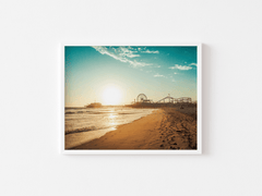 White framed Santa Monica wall art of the pier at sunset on plain background