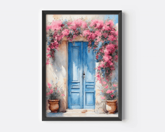 Black-framed Santorini blue door print with pink flowers on a plain background