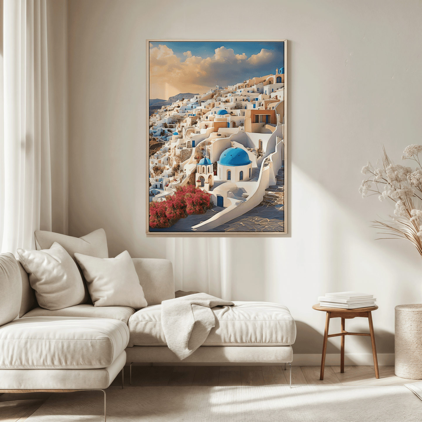 Santorini Greece wall art in a natural wood frame above a sofa in a neutral living room