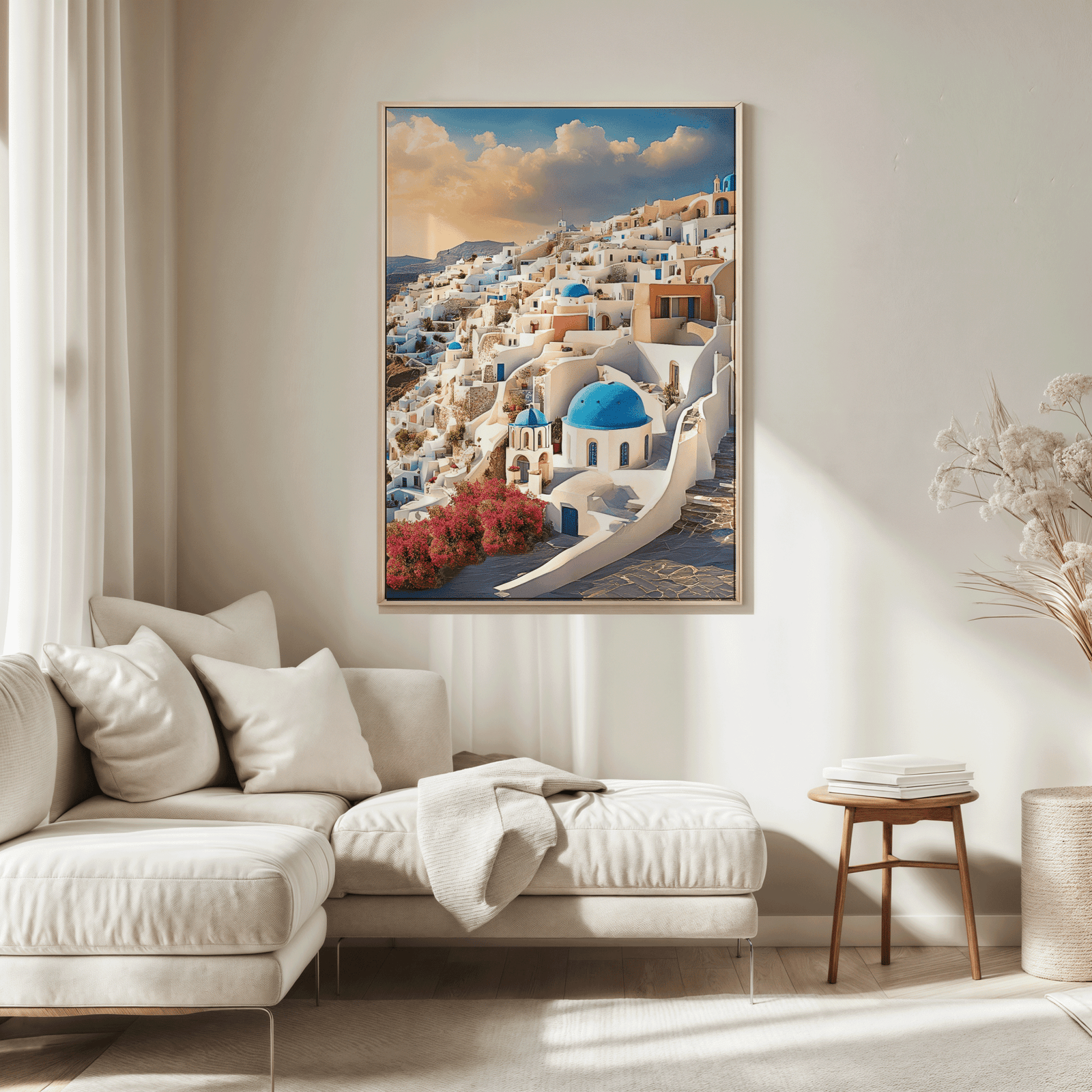 Santorini Greece wall art in a natural wood frame above a sofa in a neutral living room