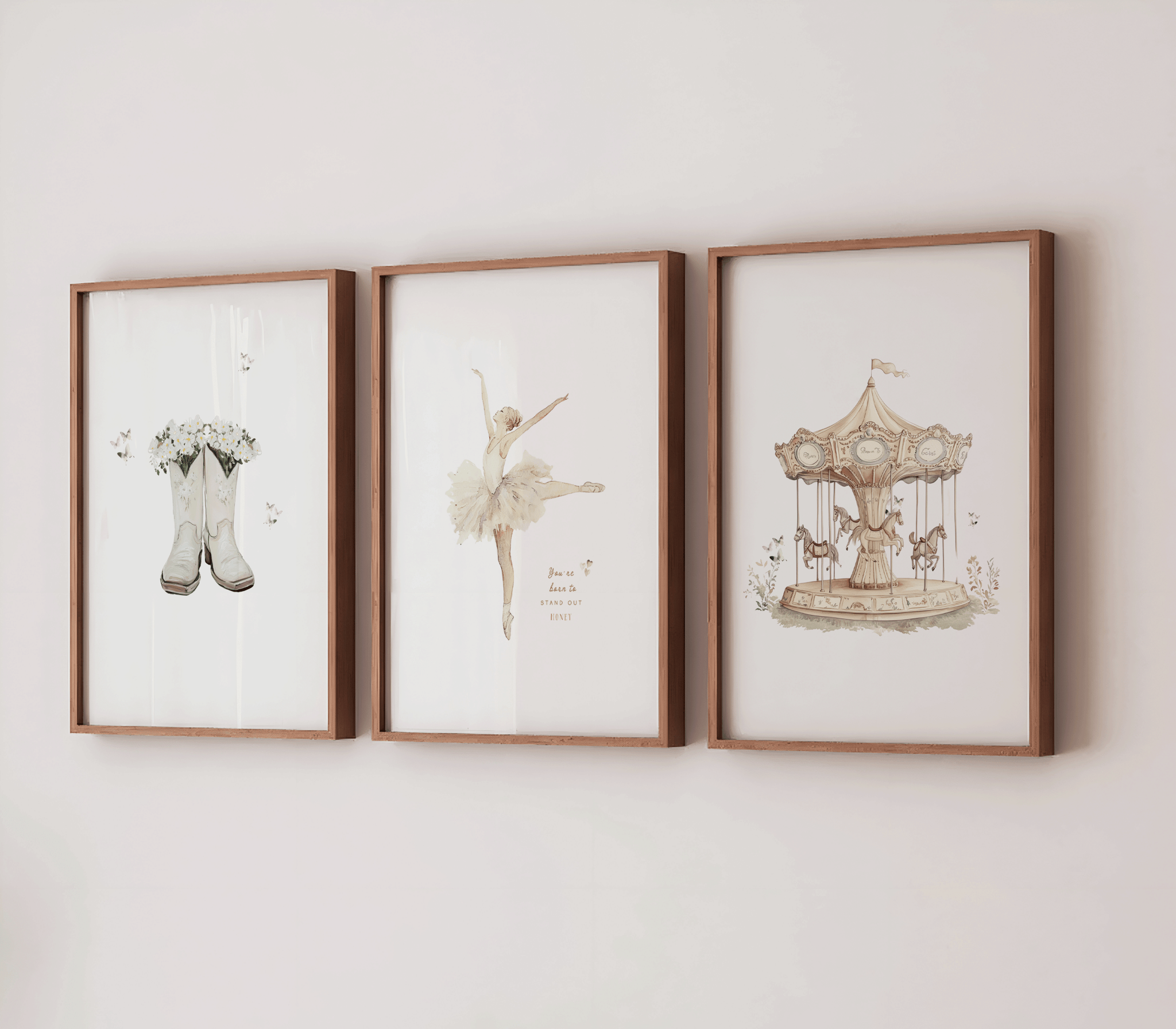Set of 3 vintage nursery wall art prints framed on a white wall featuring a vintage carousel print in a wooden frame, a vintage ballerina in a tutu, and boots with flowers and butterflies