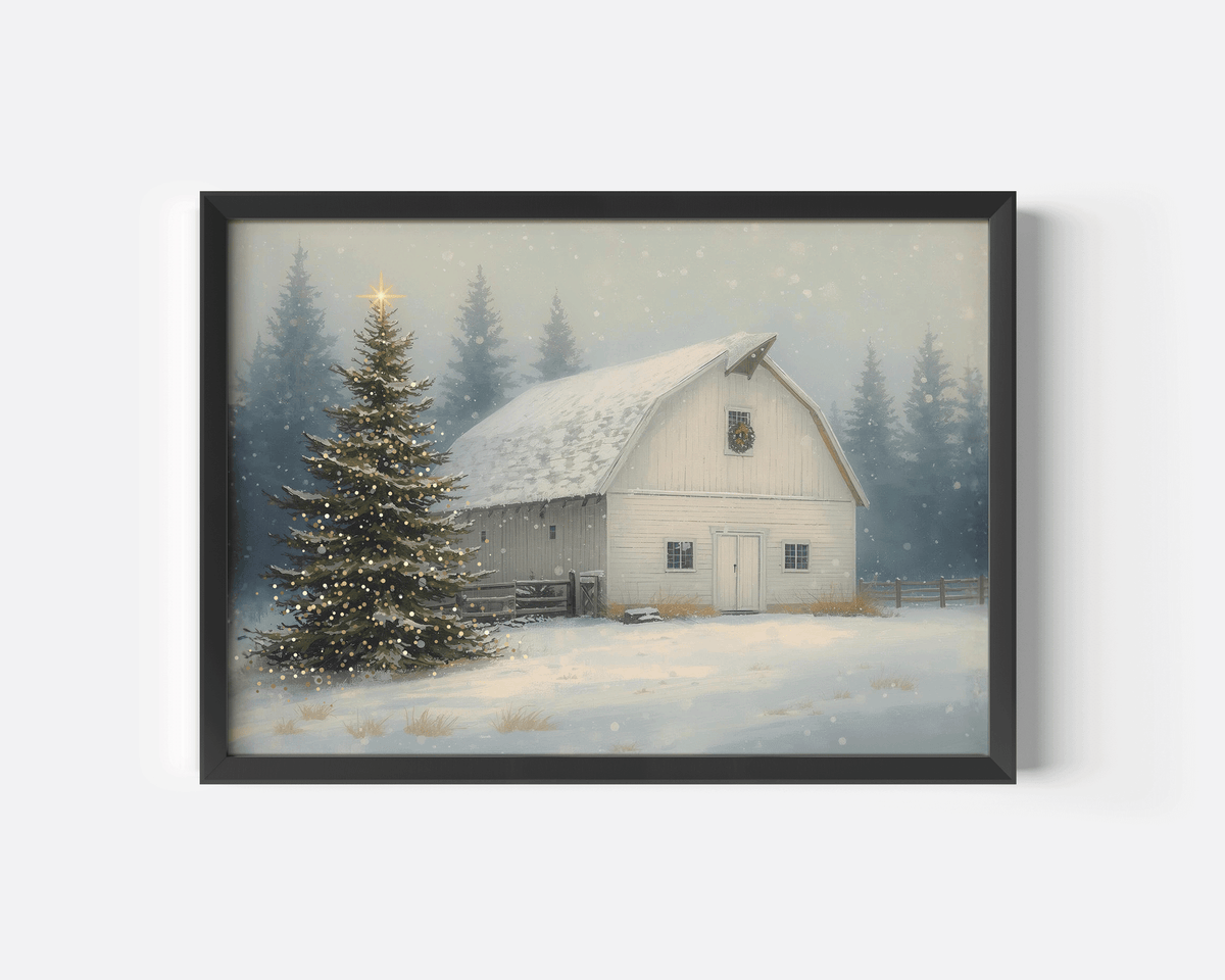 Snowy barn Christmas print in a black frame with a glowing evergreen and soft falling snow