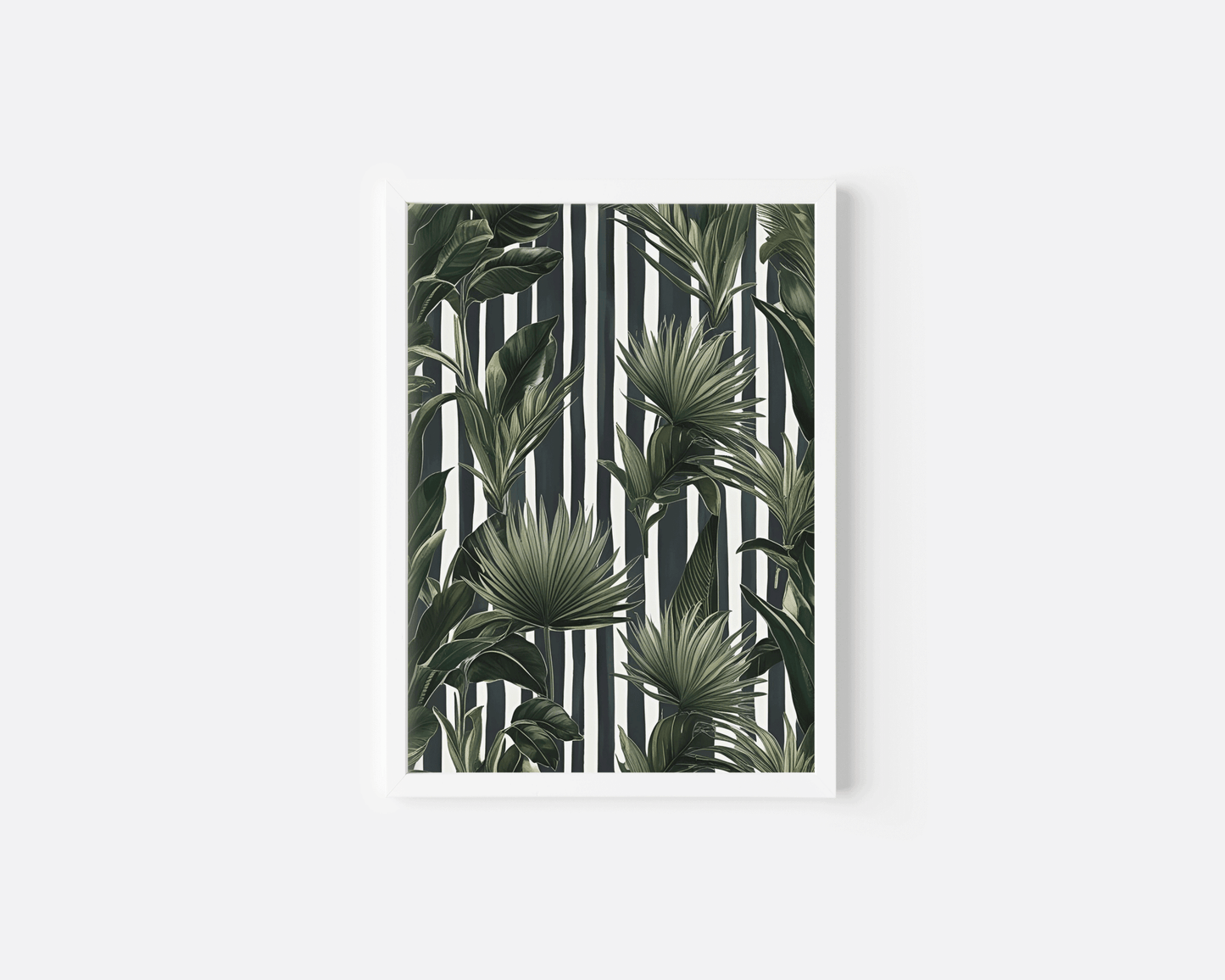 Striped tropical wall art in a white frame, green palm and banana leaves on black and white stripes