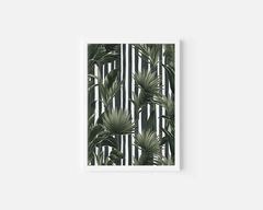 Striped tropical wall art in a white frame, green palm and banana leaves on black and white stripes