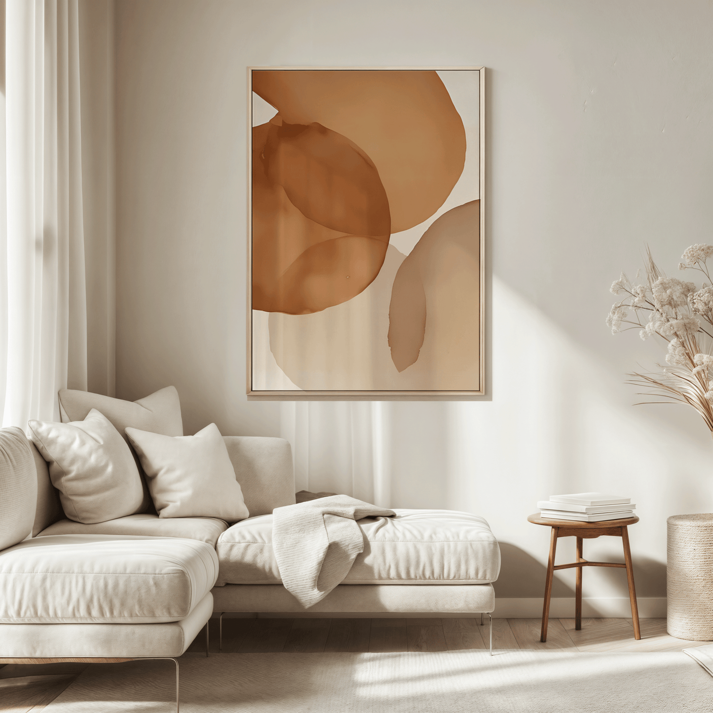 Neutral terracotta watercolor abstract canvas wall art hung above cream sectional sofa in a neutral, modern living room. 