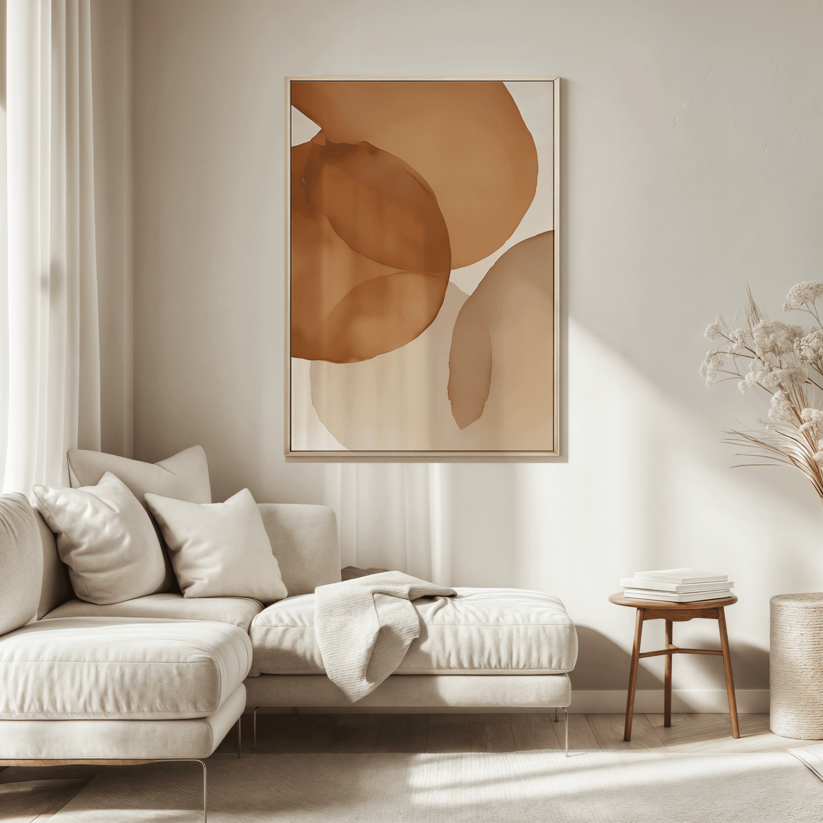 Neutral terracotta watercolor abstract canvas wall art hung above cream sectional sofa in a neutral, modern living room. 