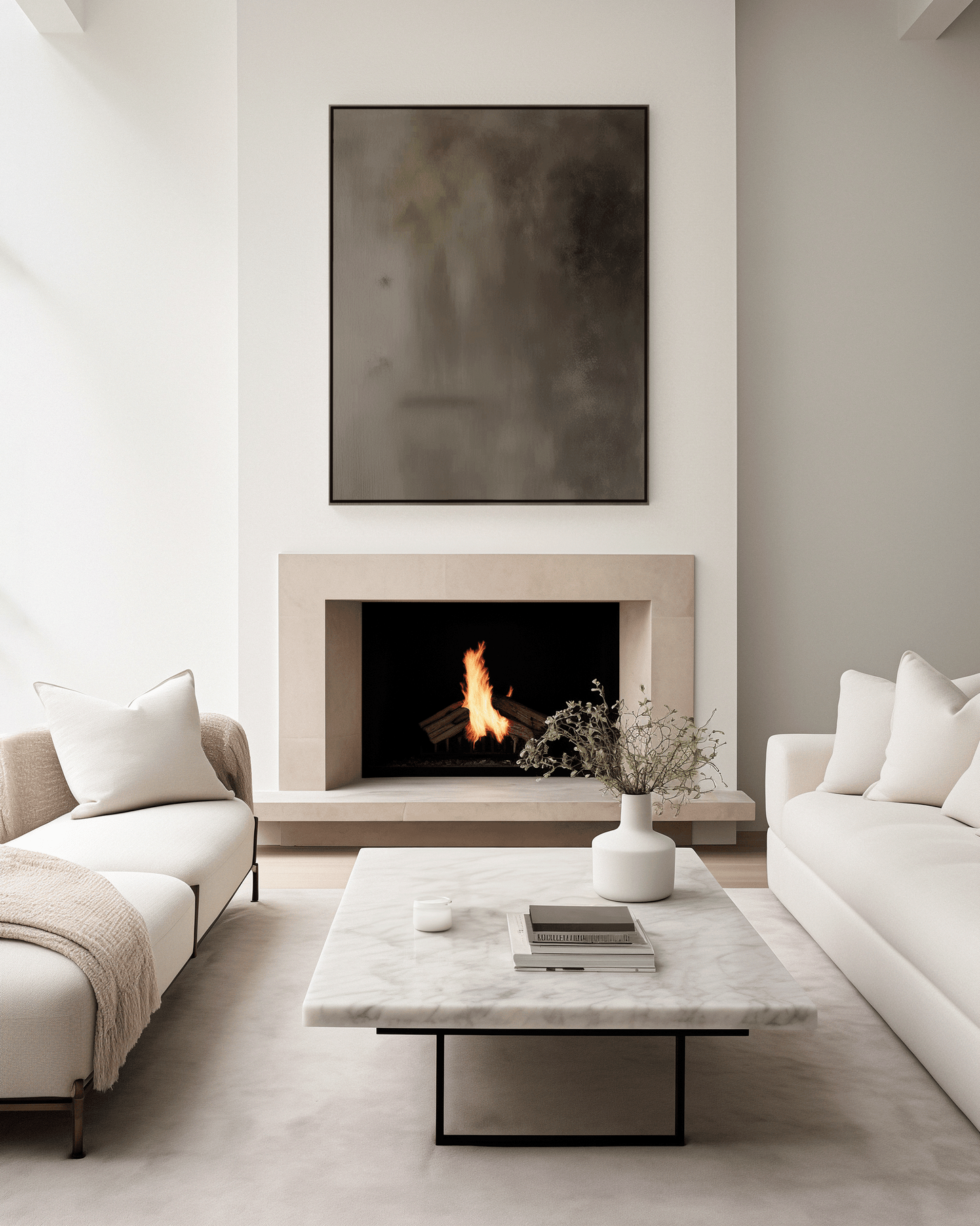 Moody earthy tonal abstract wall art framed above modern fireplace in neutral living room with cream couches and marble table