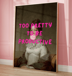 Framed funny retro wall art print with a classical female portrait and pink text 'Too Pretty to be Productive' on a pink wall.