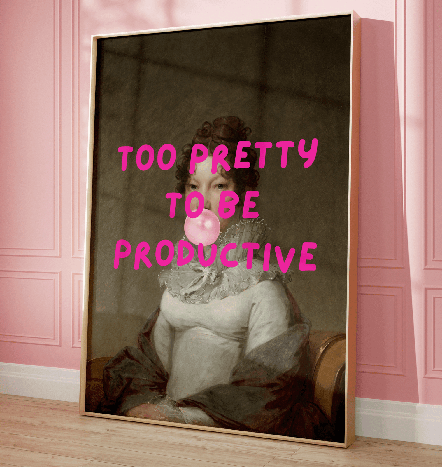 Framed funny retro wall art print with a classical female portrait and pink text 'Too Pretty to be Productive' on a pink wall.