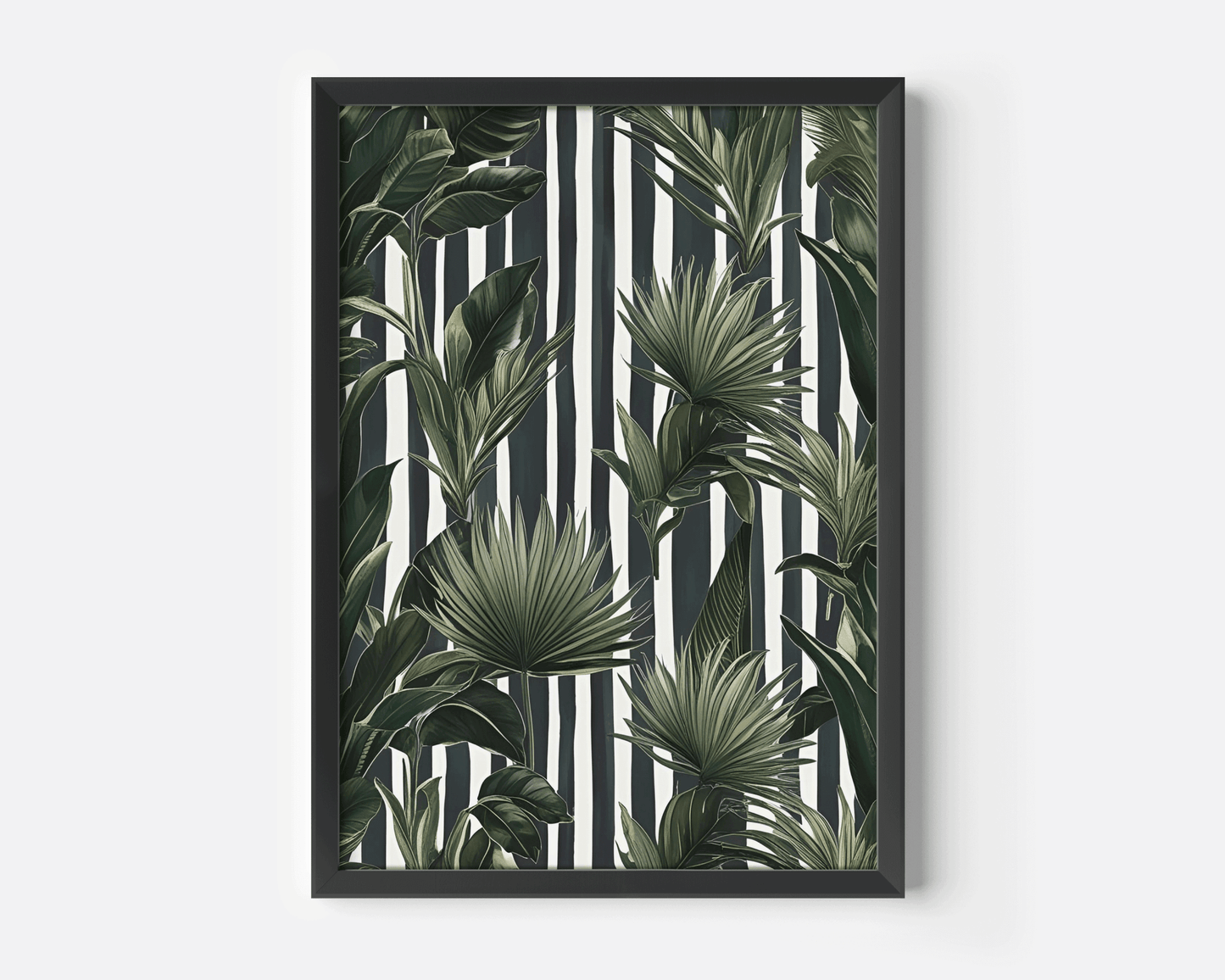 Tropical leaves wall art in a black frame, green botanical print on a black and white striped background