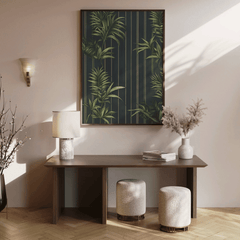 Walnut framed tropical wall art above a console table in a warm entryway