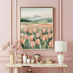 Tulip landscape print in a natural frame on a pink wall above a gold vanity with perfume bottles and flowers