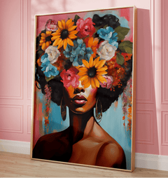 Modern flower head wall art with a black woman and bold, colorful flowers perfect for bedroom. Contemporary feminine floral portrait print framed against a pink wall.