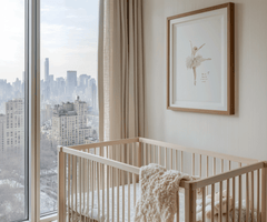 Framed vintage ballerina with tutu illustration on beige wall; warm cream nursery styling with a plush blanket in the crib overlooking the city.