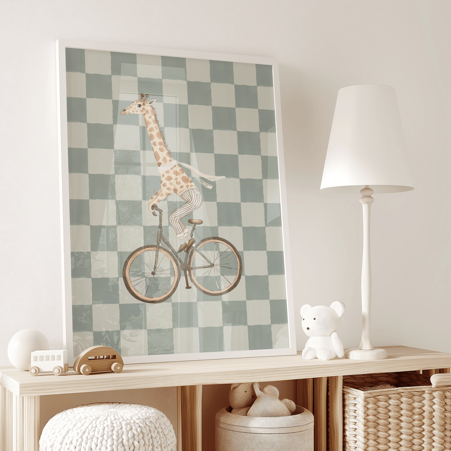 Giraffe nursery art print with green and cream checkered pattern, modern wall art for boys nursery or kids bedroom or play room on a wooden shelf with toys and a lamp