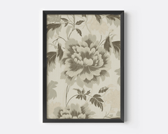 Close-up of vintage green floral wall art featuring beige botanical flowers with large soft petals framed in black