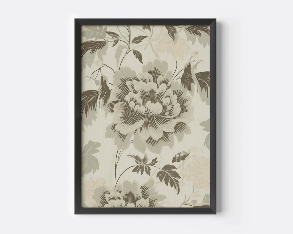 Close-up of vintage green floral wall art featuring beige botanical flowers with large soft petals framed in black
