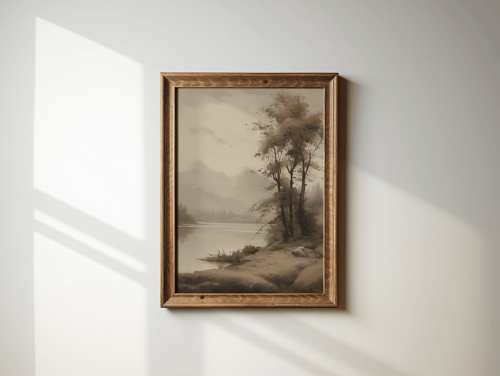 Vintage landscape wall art in wood frame with soft natural light shadows on wall
