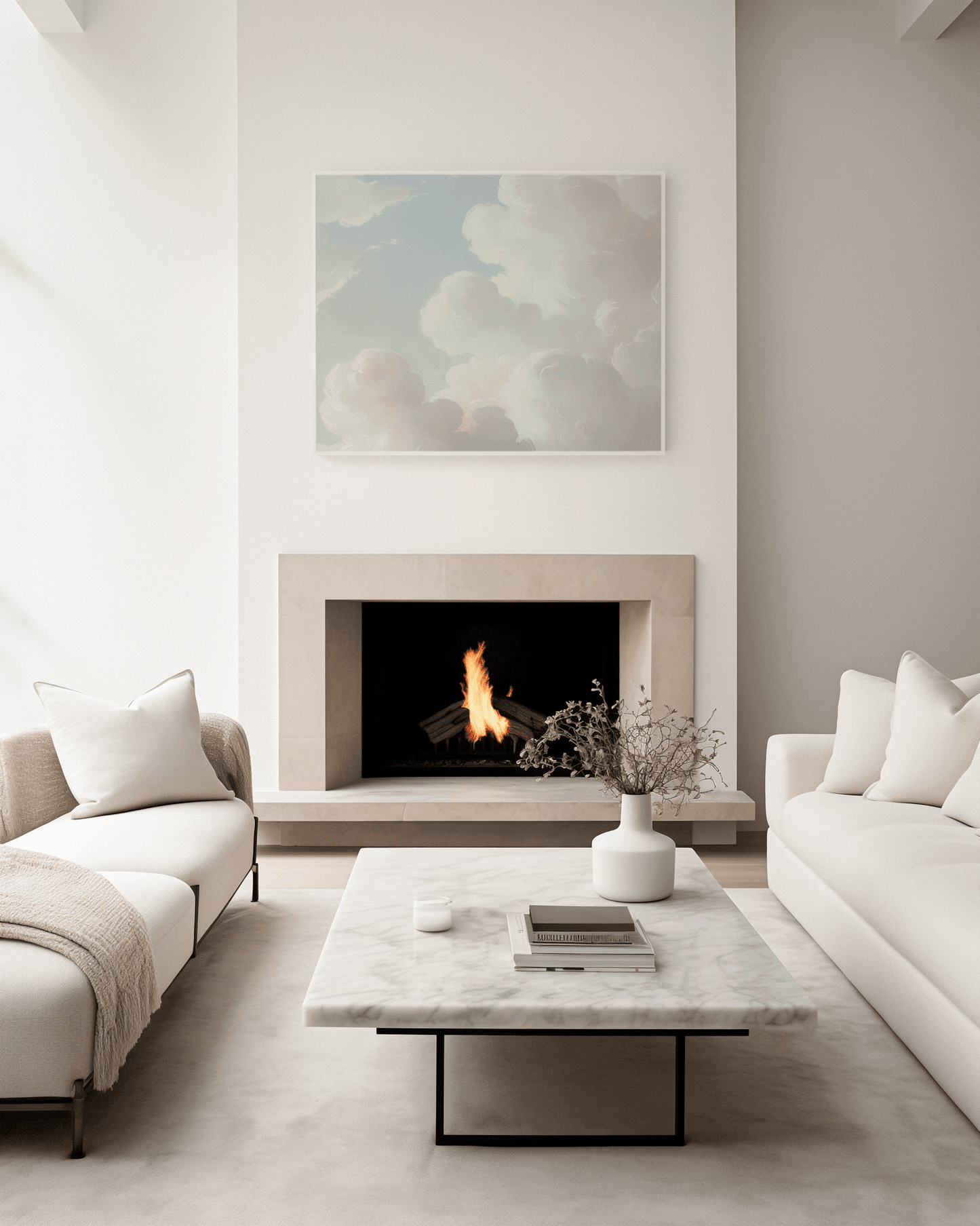 Horizontal minimal cloudscape canvas print with a white frame above modern fireplace in neutral living room