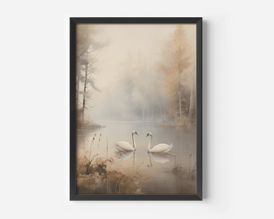 A black-framed wall art print depicting two white swans on lake surrounded by misty trees and fog