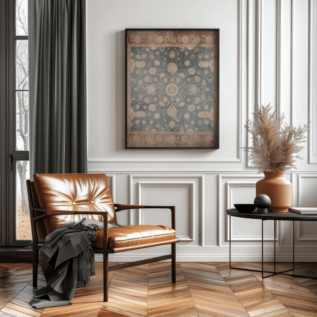 Black framed vintage tapestry wall art above a leather armchair