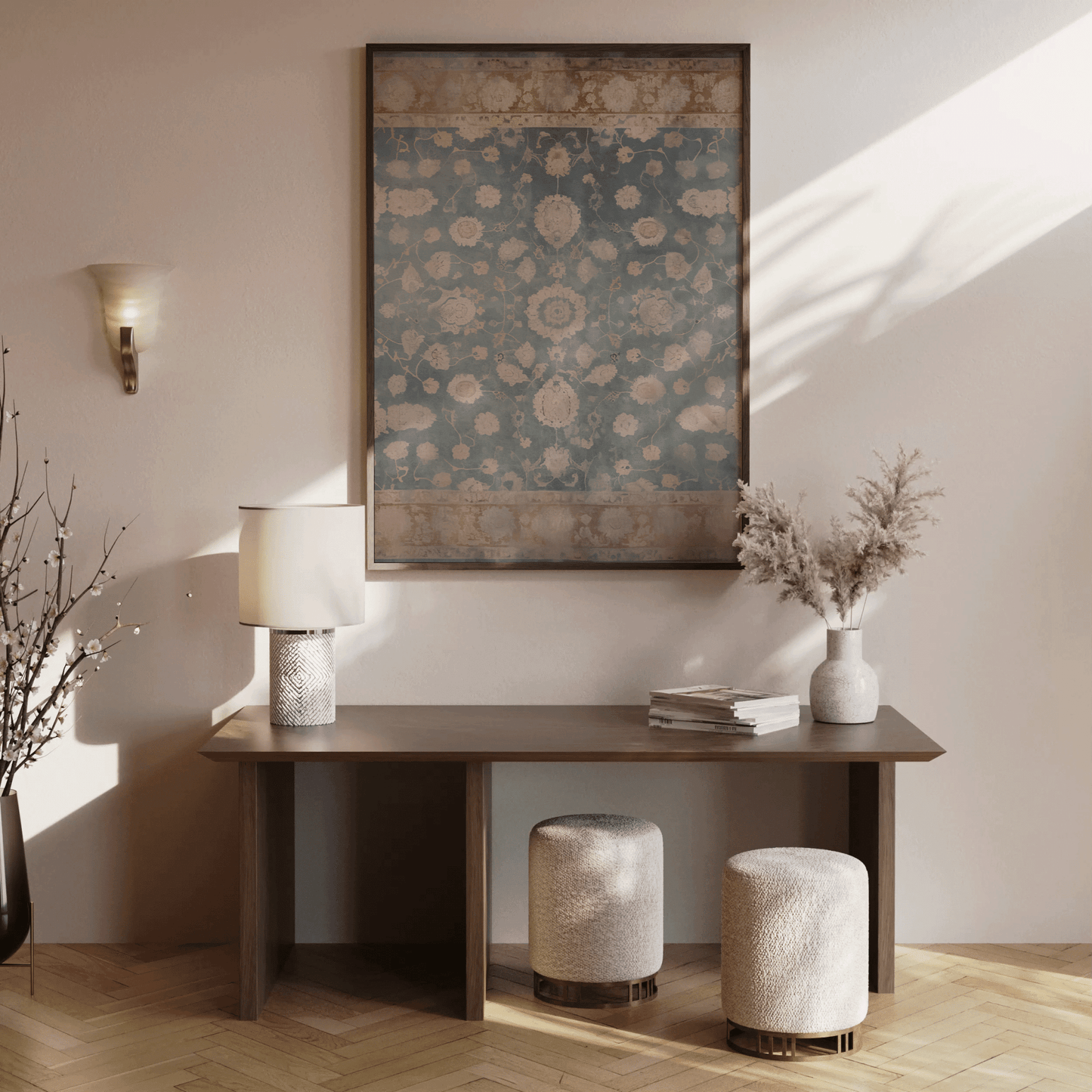 Walnut framed vintage tapestry wall art above a console table in a warm entryway