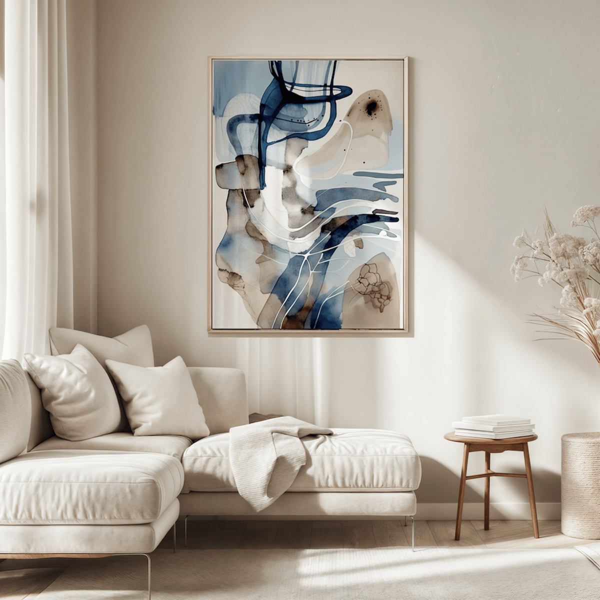 white, blue and beige abstract wall art framed above a cream sectional sofa with neutral pillows in a minimalist living room