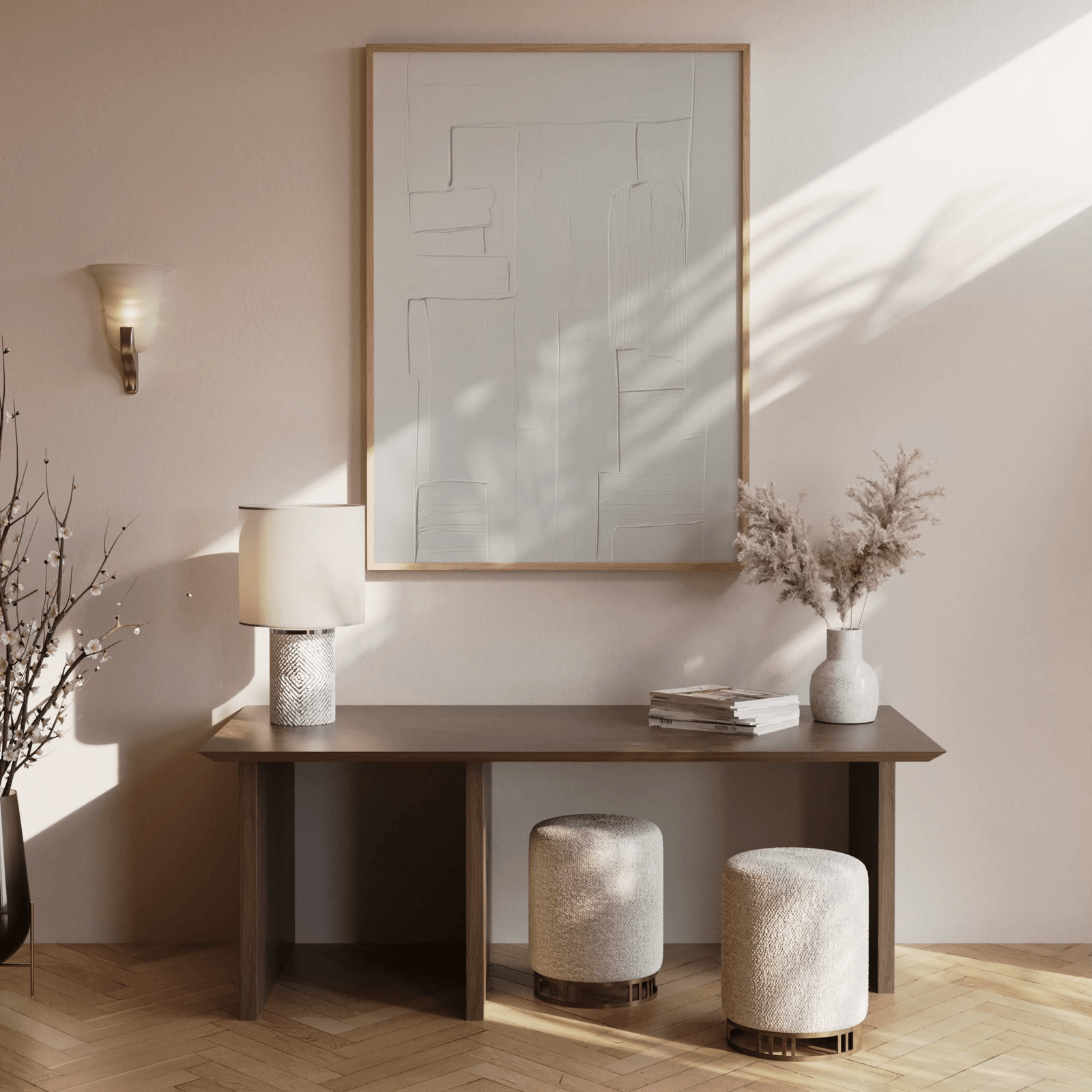 Modern interior with a brown wooden console table, lamp, and all-white tonal minimalist abstract art framed above the console table on a neutral wall.