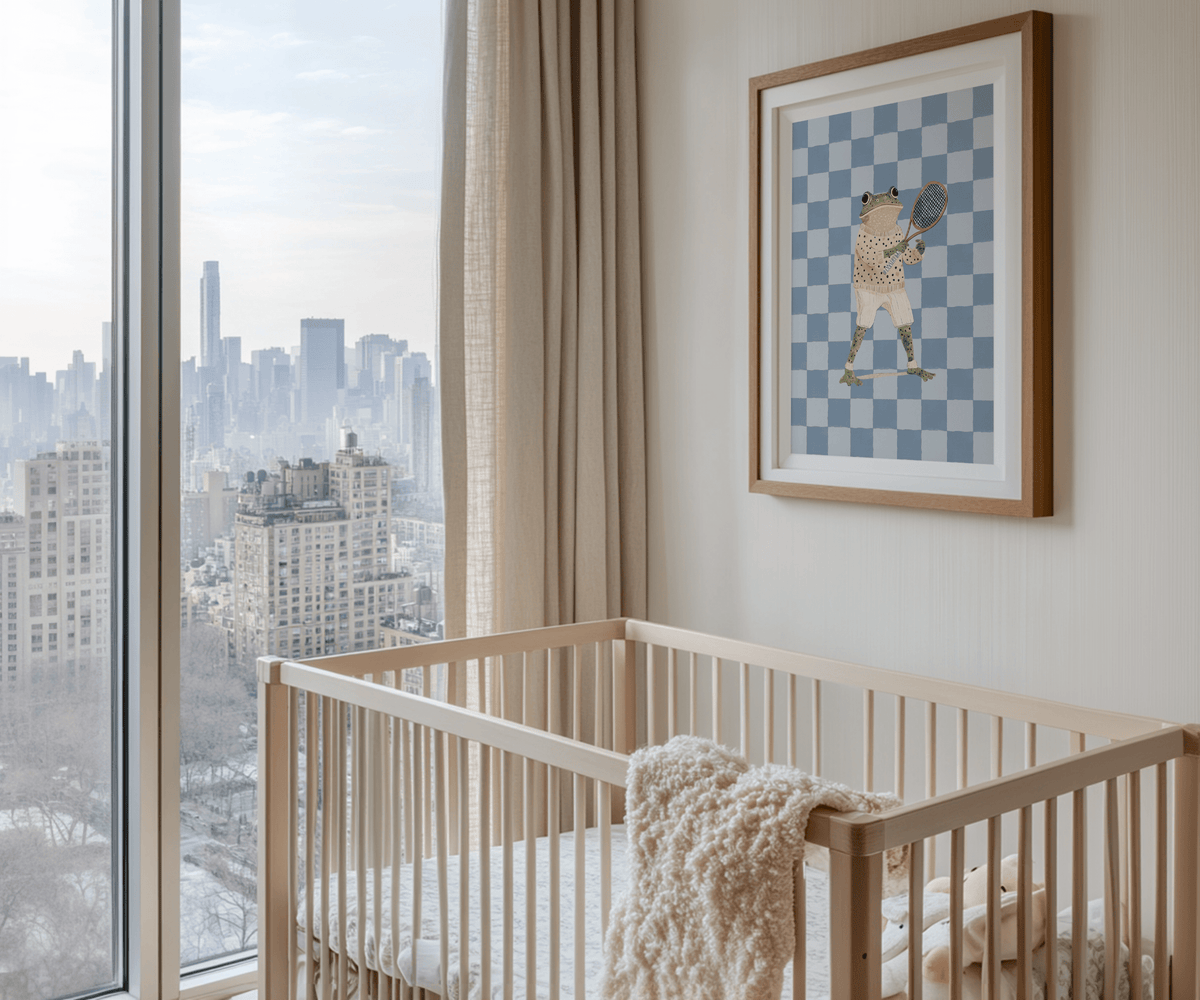 Frog nursery wall art wooden-framed above crib in minimal, neutral baby nursery with natural wood furniture and cozy accents