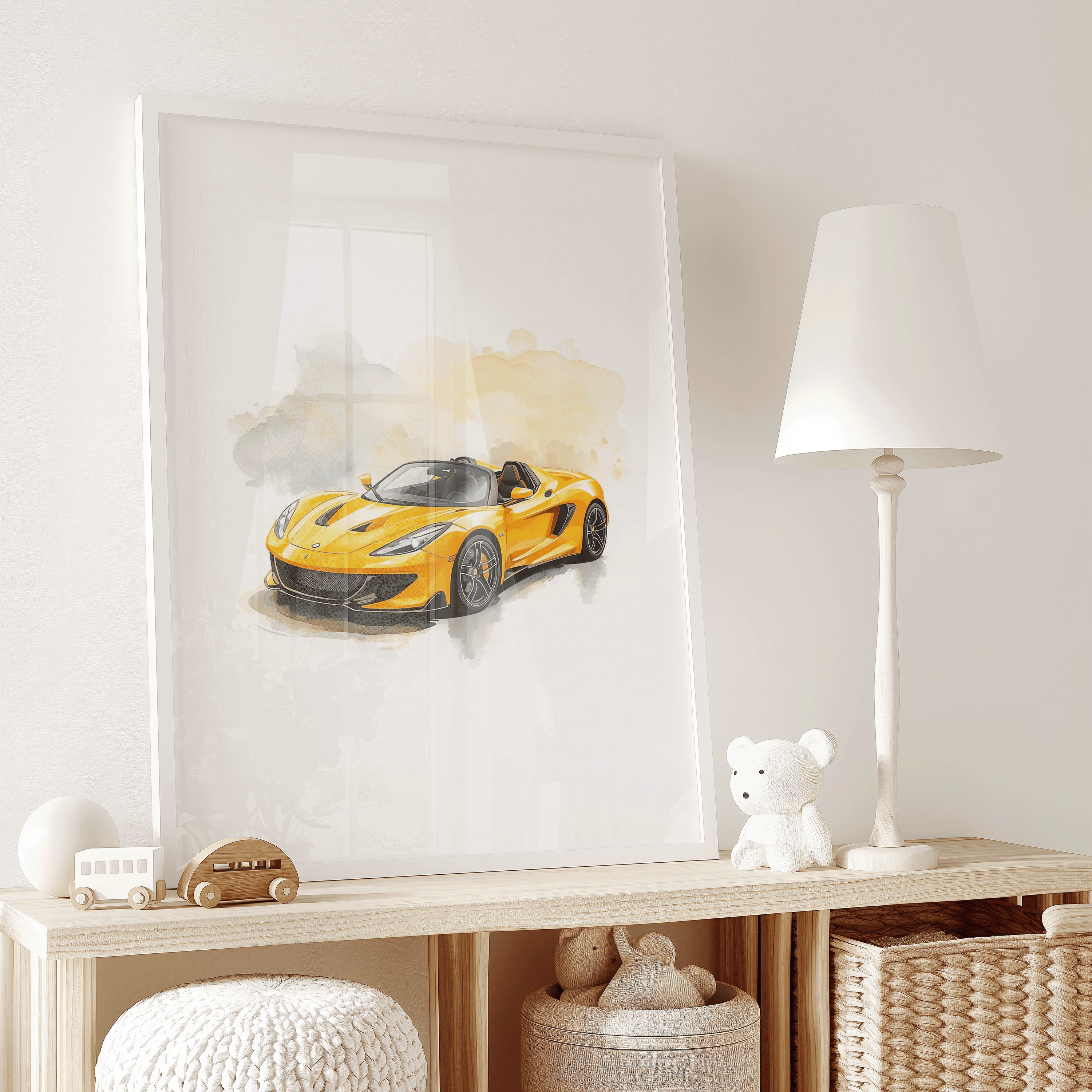 Framed yellow sports car watercolor artwork leaning on a nursery shelf beside plush toys and a table lamp, showing soft pastel background splashes and playful illustrated styling reminiscent of hot wheels car wall art for kids.
