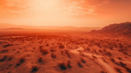 A fiery sunset over a desert landscape with deep reds and oranges