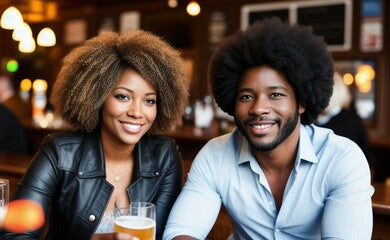 A beautiful smiling black couple on a date drinking beer in a cafe or a pub, created with generative AI