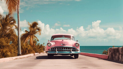 Vintage Retro Car Driving in Seaside road with palm tree and ocean view