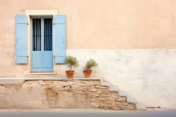 French architecture. Blue wall with door and window. Old house in the town.