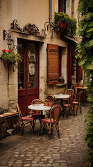 Traditional restaurant exterior with tables, chairs and menu, France