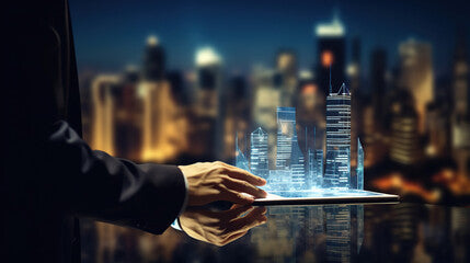 A man using digital tablet, and modern buildings hologram.