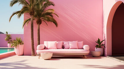 Outdoor space with sofa and palms, pink colors