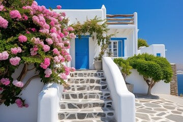 Professional Shot of a Mediterranea House in Greece. Amazing Magenta Flowers creating this shot Captivating.