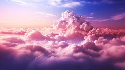 A large cloud formation in the sky. A stunning sky filled with beautiful pink and purple clouds.