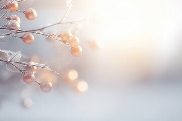 Winter background with frozen branches, berries and bokeh lights.